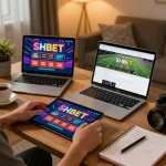 Engaging online gaming scene featuring SHBET app on tablet, displaying vibrant casino graphics
