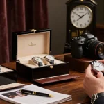 Replica watch inspection in a luxurious setup with elegant timepieces and accessories.